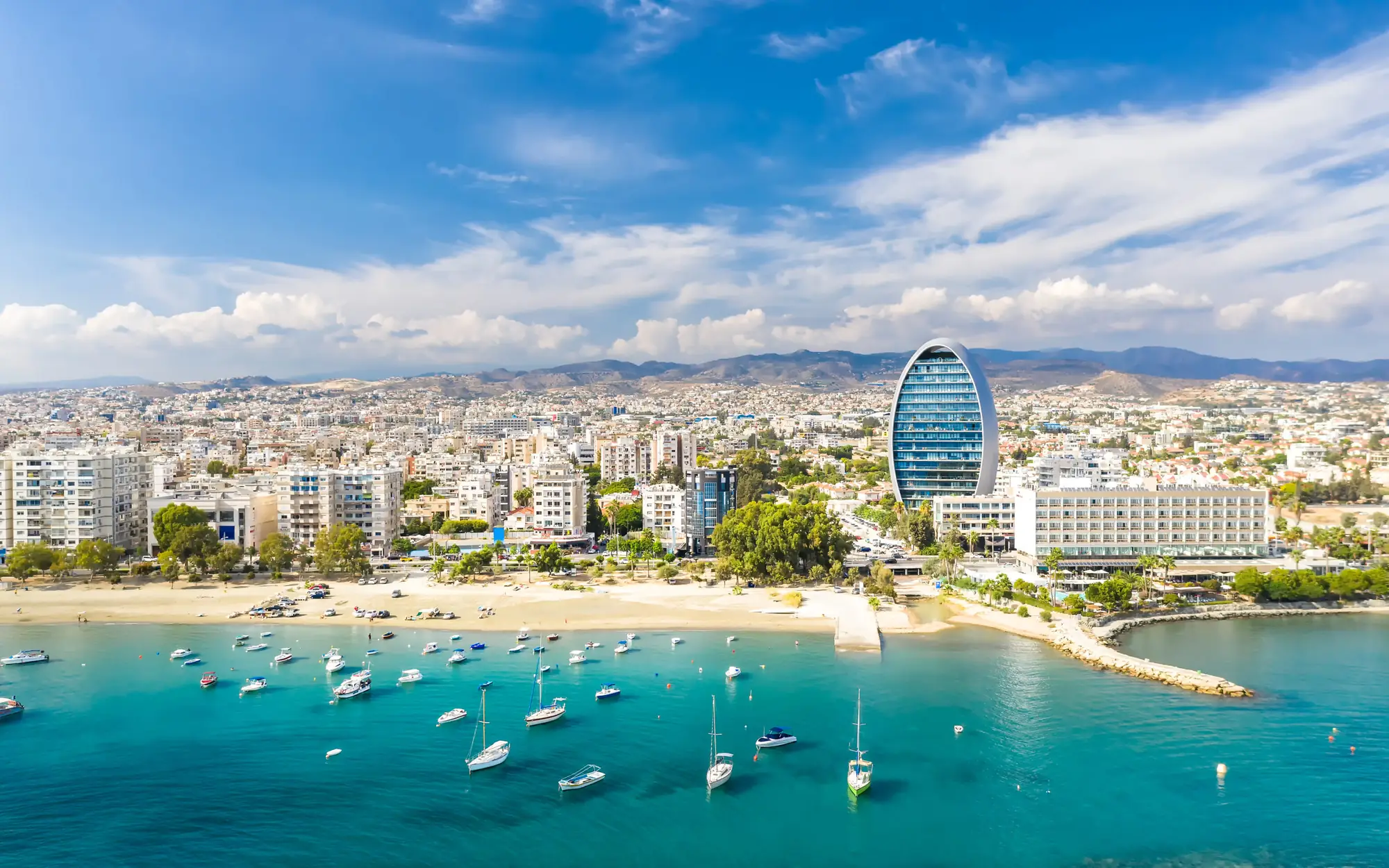 Aerial view of the Limassol seafront with yachts in a turquoise bay